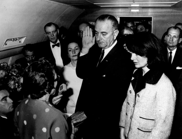 Image: Lyndon B. Johnson is sworn in as President of the United States of America in the cabin of the presidential plane as Jacqueline Kennedy stands at his side