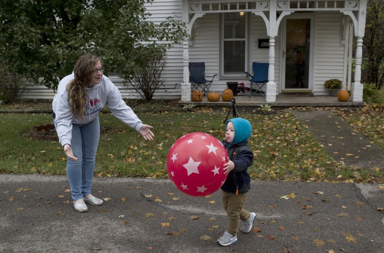 Image: Parker Hurt plays ball with his mother
