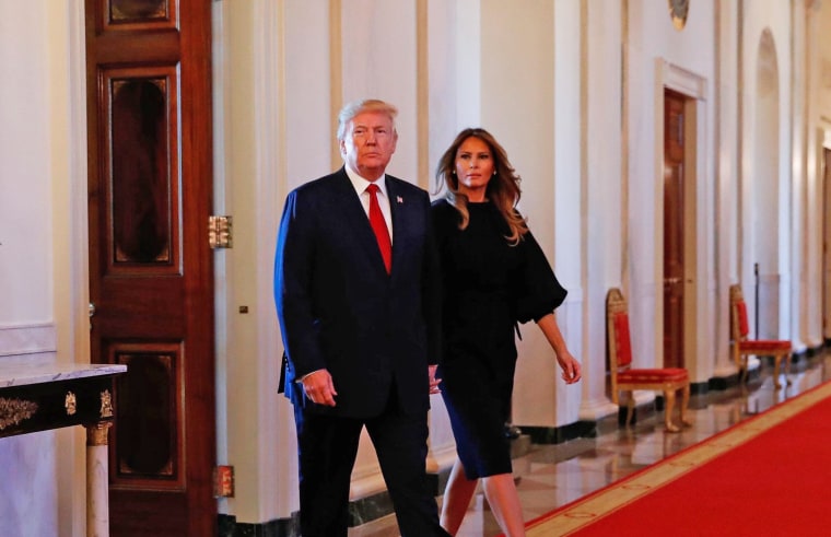 Image: U.S. President Donald Trump arrives with First Lady Melania Trump before he speaks about administration plans to combat the nation's opioid crisis in the East Room of the White House in Washington