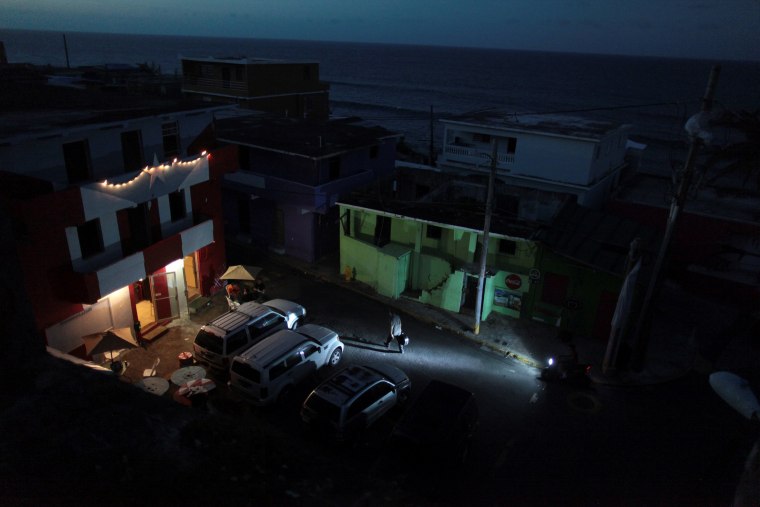 Image: A house is lit up with the help of a generator next to houses in the dark, after Hurricane Maria hit the island and damaged the power grid in September, in Old San Juan