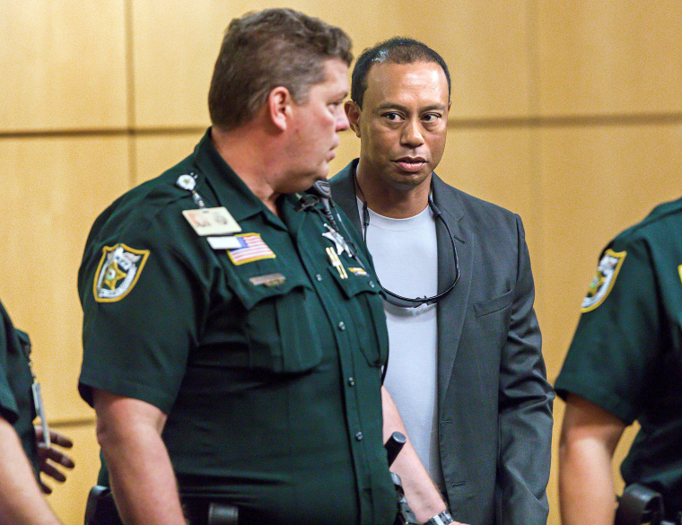 Image: Golfer Woods leaves Palm Beach County court after he pleaded guilty to a charge of reckless driving in Palm Beach
