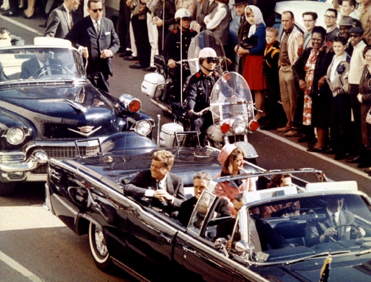 Image: President John F. Kennedy, First Lady Jaqueline Kennedy and Texas Governor John Connally ride  in a liousine moments before Kennedy was assassinated, in Dallas