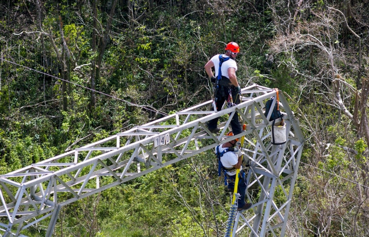 Image: Whitefish Energy Holdings workers restore power lines damaged by Hurricane Maria in Barceloneta, Puerto Rico