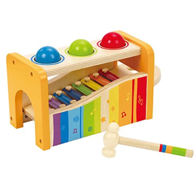 Pound and tap bench with slide out xylophone