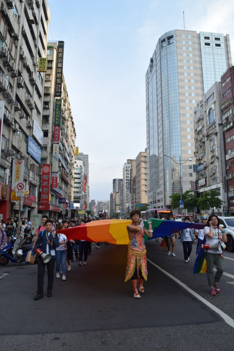 Marchers carry a rainbow flag at the 15th annual Taiwan LGBT Pride event in Taipei.