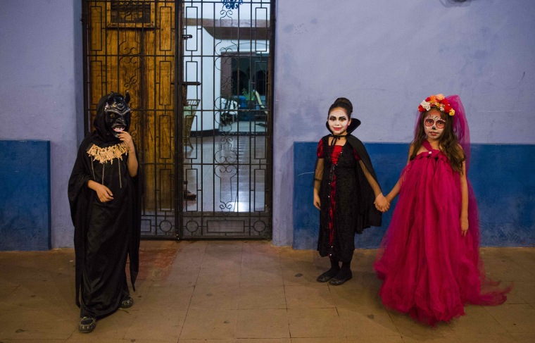Image: Children dressed as witches and demons for the 'Los Aguizotes' celebration in Masaya, Nicaragua on Oct. 27.