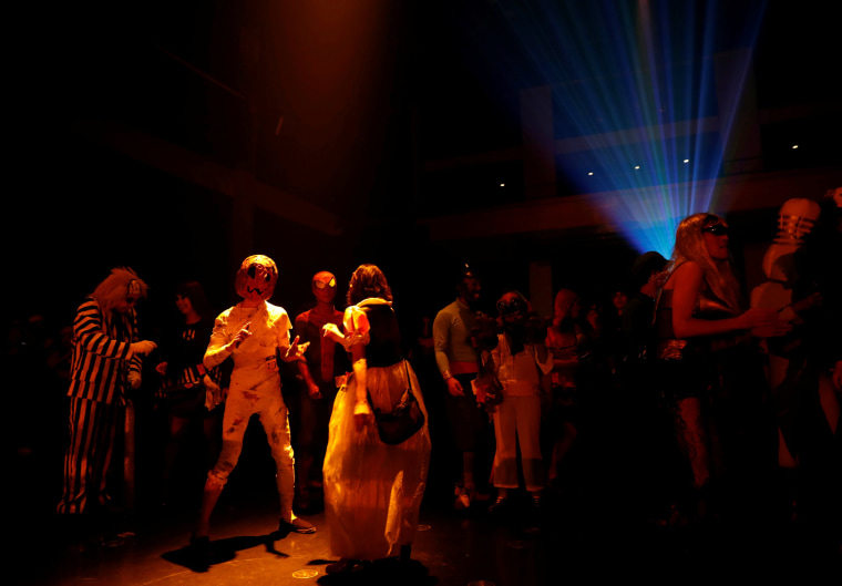 Image: Participants in costumes dance at a club during a Halloween event in Kawasaki, south of Tokyo on Oct. 29.