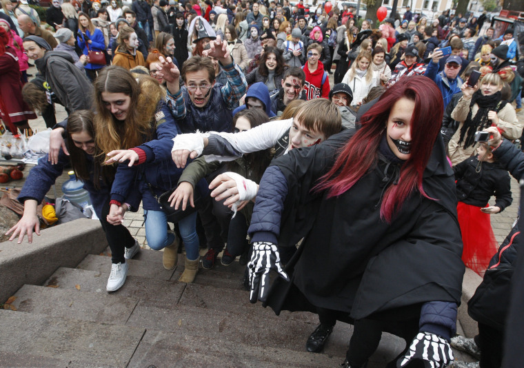 Image: Ukrainians wearing zombie costumes and make-up walk through the streets for the Zombie Halloween parade in Kiev, Ukraine on Oct. 28.