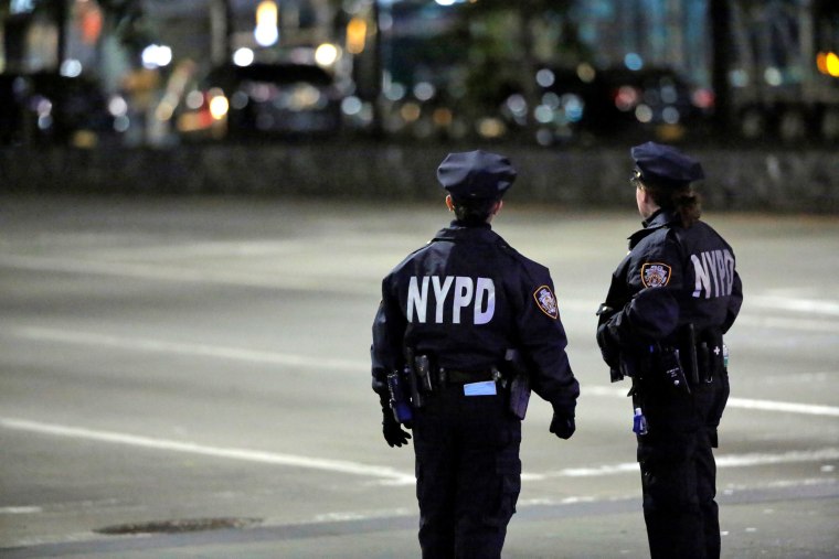 Image: Police look towards the scene of a pickup truck attack on West Side Highway in Manhattan, New York