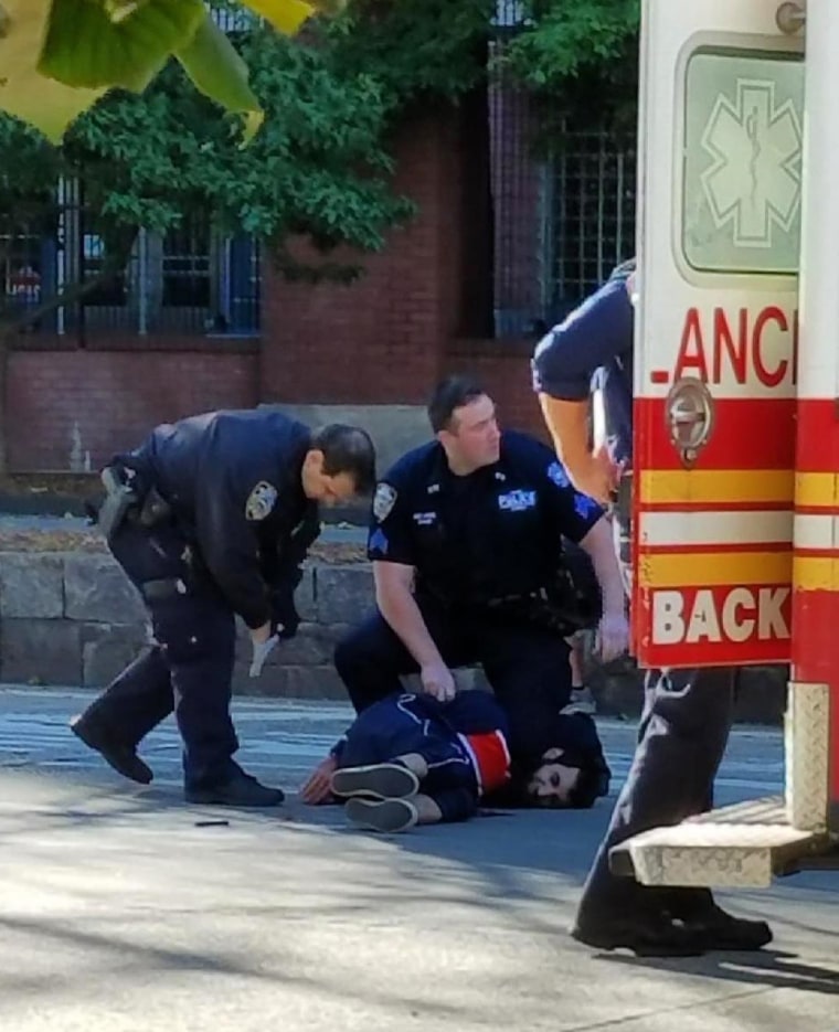 Image: Police hold down suspect Sayfullo Habibullaevic Saipov after an attack in New York