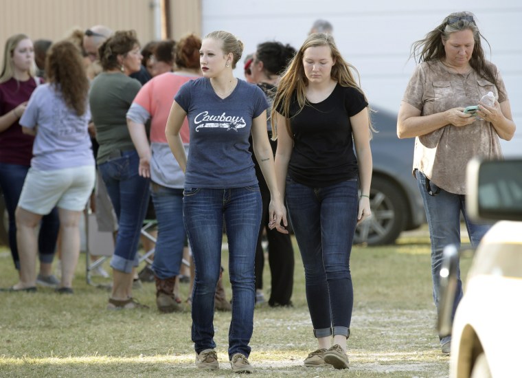 Image: People gather near First Baptist Church following a shooting