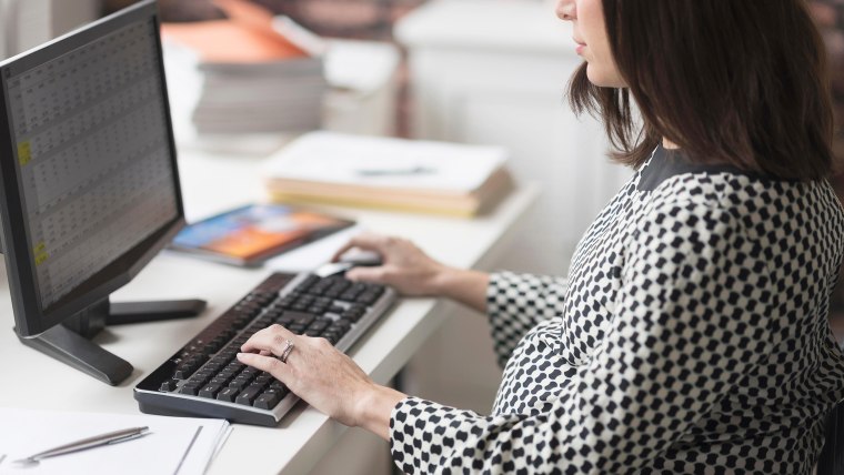 Pregnant woman working in office