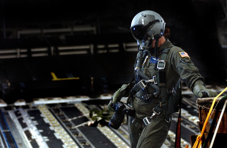 Staff Sgt. Stacy preparing to document an aerial formation from the ramp of a C-17 Globemaster aircraft during a high altitude, low oxygen flight, Charleston Air Force Base, SC. U.S. Air Force photo