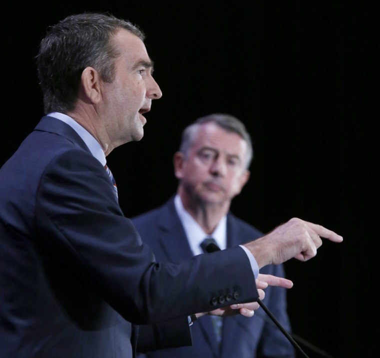 Democratic gubernatorial candidate Lt. Gov. Ralph Northam, left, makes a point as GOP gubernatorial candidate Ed Gillespie watches at the Omni Homestead Resort in Hot Springs, Virginia, on July 22.