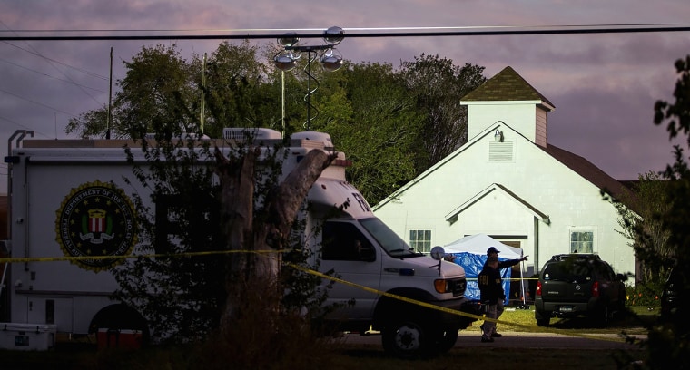 Image: An FBI agent works in front of the First Baptist Church on Nov. 6, 2017, where a gunman opened fire on a Sunday service in Sutherland Springs, Texas.