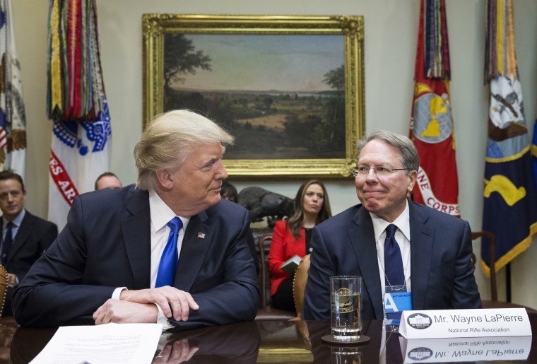 Image: President Donald Trump sits next to National Rifle Association Executive Vice President Wayne LaPierre at the White House