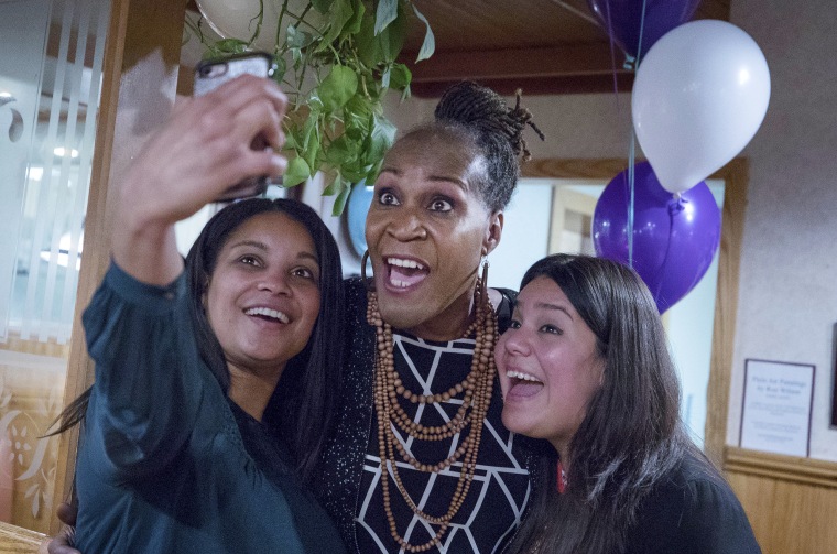 Image: Deebaa Sirdar, left, and Sara Lopez, right, take a selfie with Andrea Jenkins