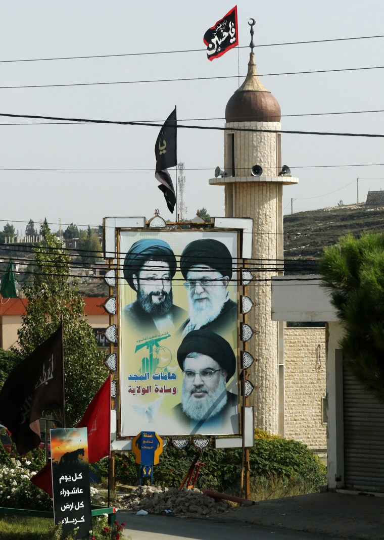 Image: Portraits of Musa al-Sadr, Ali Khamenei and Hasan Nasrallah