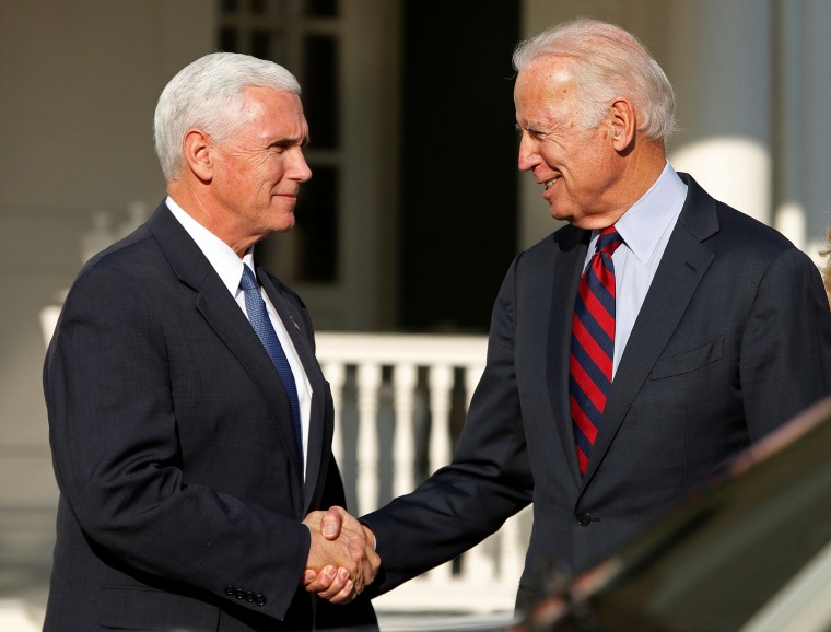 Image: Vice President Joe Biden shakes hands with Vice President-elect Mike Pence after their meeting and lunch at the Naval Observatory in Washington