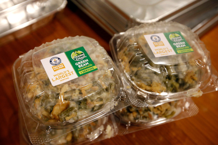 Individual servings from the Guinness World Records Largest Serving of Green Bean Casserole, made by Green Giant and weighing in at 637 pounds, are prepared for donation to Citymeals on Wheels, Thursday, Nov. 16, 2017 in New York. (Jason DeCrow/AP Images for Green Giant)