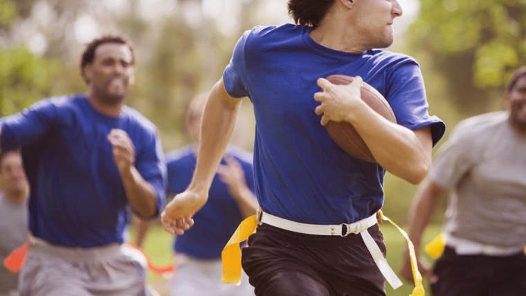 Men playing flag football