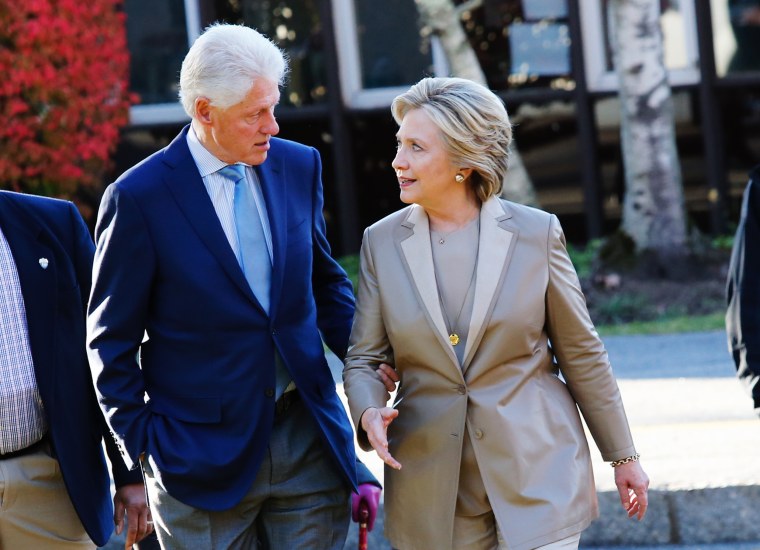 Image: Then Democratic presidential nominee Hillary Clinton talks with her husband, and former President, Bill Clinton