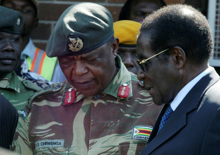 Image: Zimbabwe's leader Robert Mugabe, pictured in 2008 talking to military general Constantino Chiwenga.