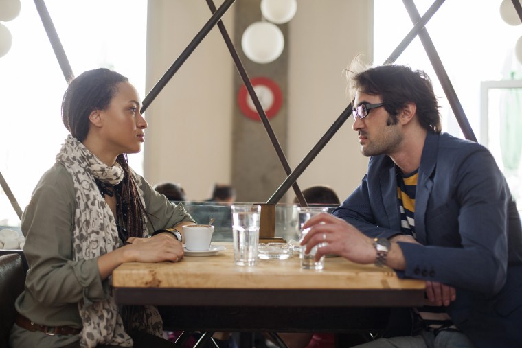 Image: A couple talks in a cafe