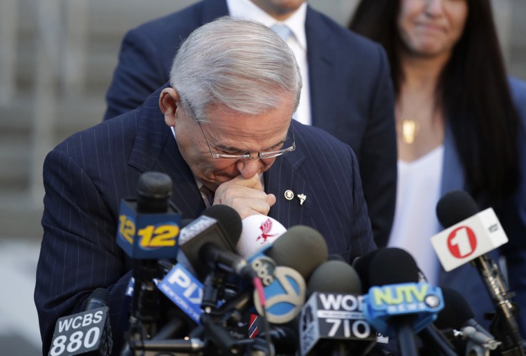 Image: Menendez fights tears as he speaks to reporters