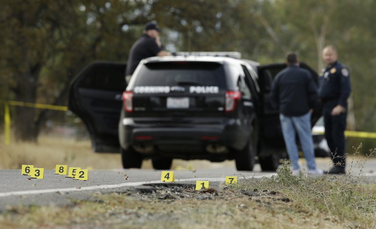 Image: Yellow tags mark where bullet casings were found