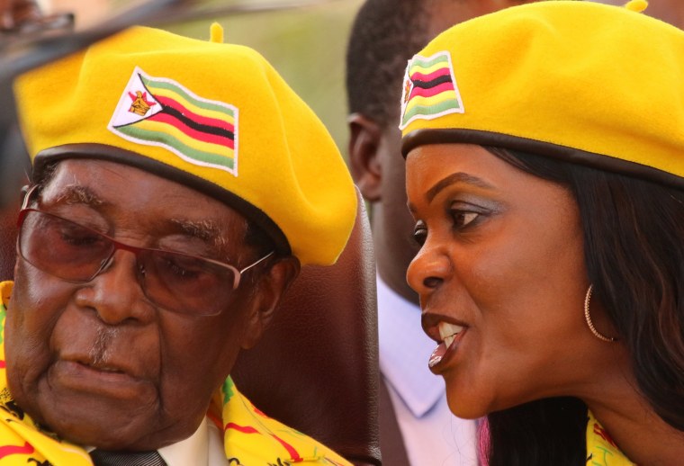 Image: President Robert Mugabe listens to Grace Mugabe at a rally in Harare