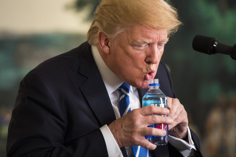 Image: Trump pauses to drink water while touting his foreign policy accomplishments