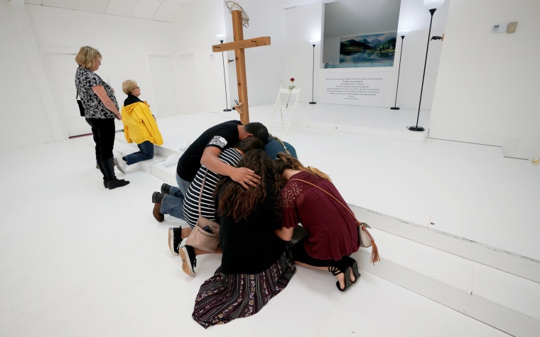 Image: People Pray in the First Baptist Church of Sutherland Springs Following the Shooting Attack in Texas