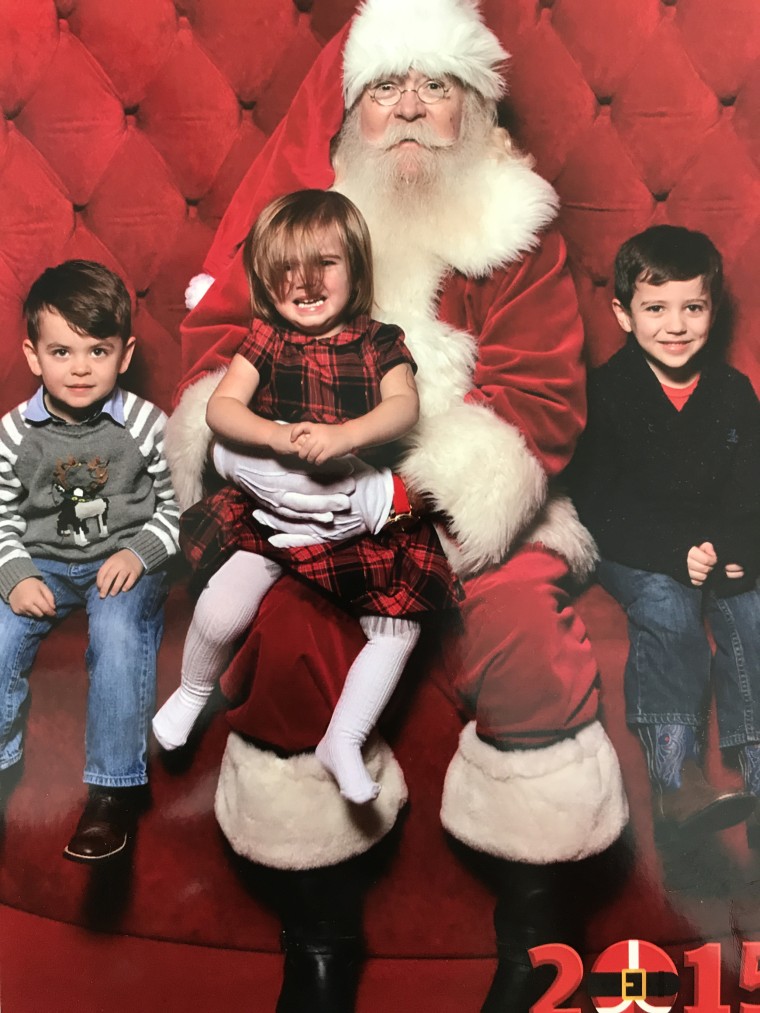 A misplaced hair bow and a crying toddler did not stop Emily Walker from getting a photo of her kids with Santa.