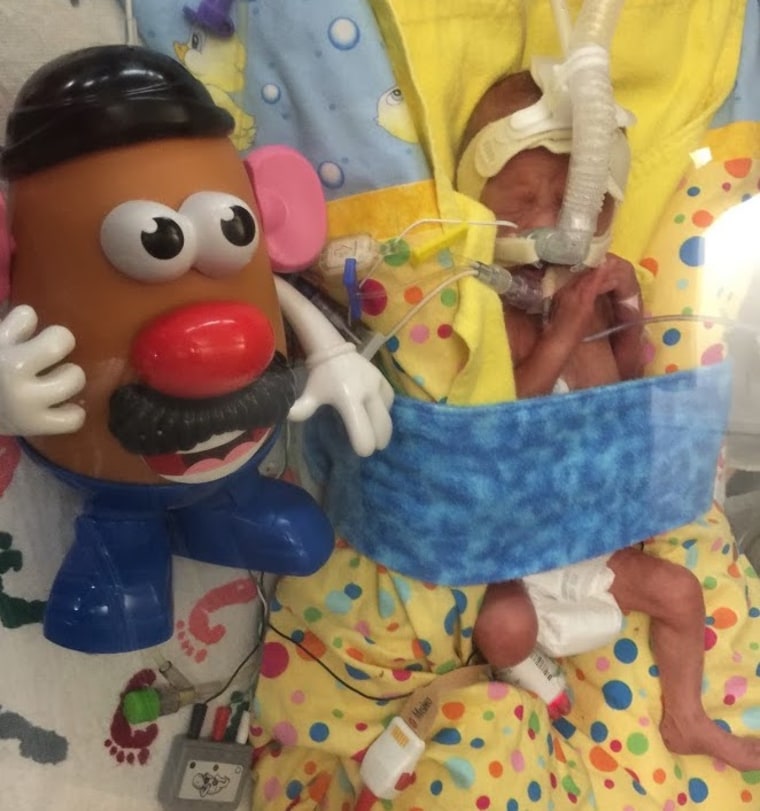 Henry Bohlman with his Mr. Potato Head doll at 10 days old.