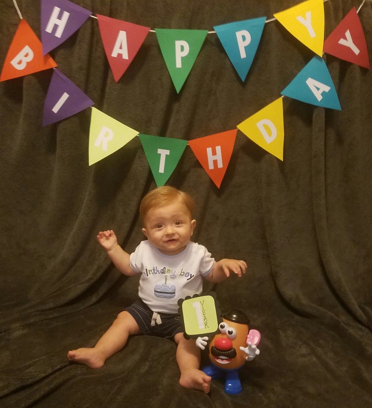 MJ White with his Mr. Potato Head doll on his first birthday.