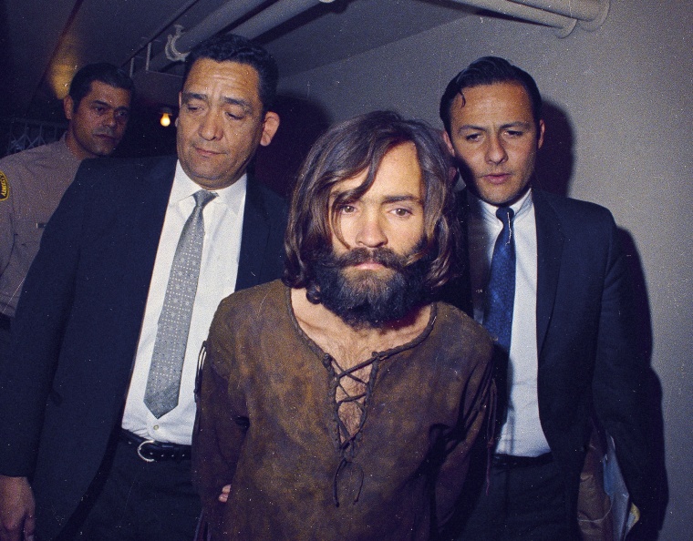 Image: Charles Manson is escorted to his arraignment on conspiracy-murder charges in connection with the Sharon Tate murder case in 1969 in Los Angeles, Calif.