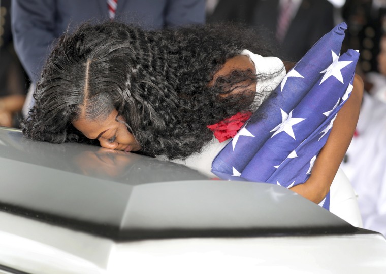 Image: Myeshia Johnson, wife of U.S. Army Sergeant La David Johnson, kisses his coffin at a graveside service