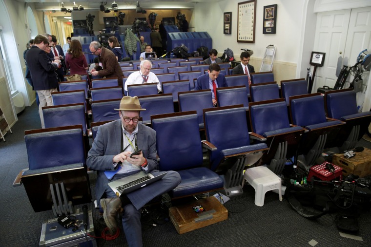 Image: Glenn Thrush, chief White House political correspondent for the The New York Times, works in the White House briefing room
