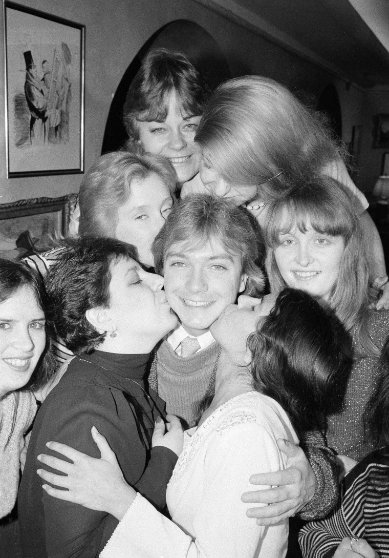 Image: David Cassidy is surrounded and kissed by presidents of his fan clubs from various parts of the United States and Europe