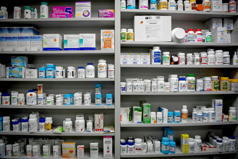 Image: Bottles of Medications Line the Shelves at a pharmacy in Portsmouth