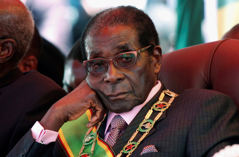 Image: FILE PHOTO - File photo of Zimbabwe's President Mugabe looking on during a rally marking Zimbabwe's 32nd independence anniversary celebrations in Harare