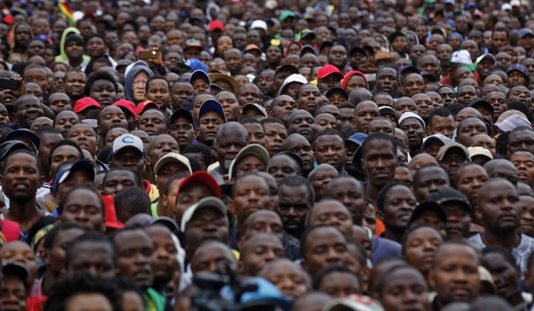 Image: Protesters gather at a demonstration for the ouster of 93-year-old leader Robert Mugabe