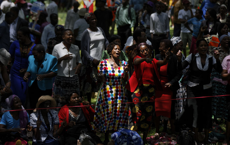 Image: Zimbabweans gather to pray for the country in a park opposite the parliament building