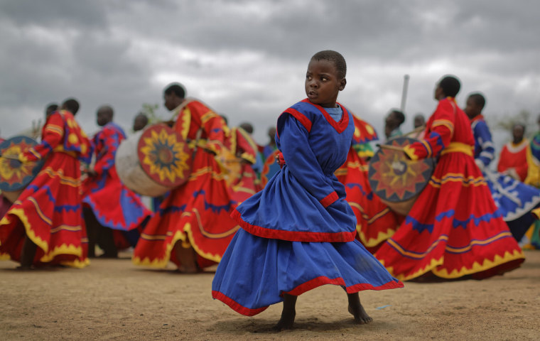 Image: Members of the International Apostolic Ejuwel Jekenisheni Church dance, sing, pray, and play drums during a morning service at the open-air church