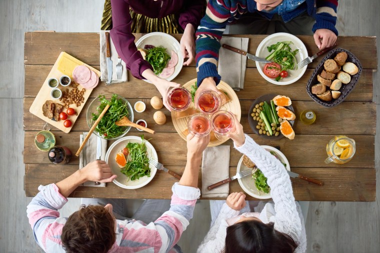 Image: Friends Gathering at Dinner Table