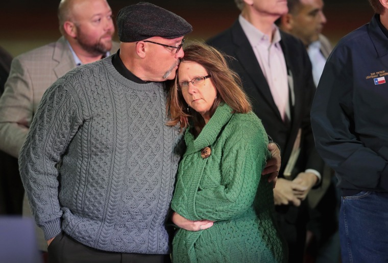 Image: Pastor Frank Pomeroy comforts his wife Sherri during a memorial service for the victims of the First Baptist Church of Southerland Springs shooting