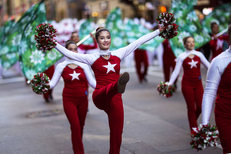 Image: Cheerleaders march along Sixth Avenue