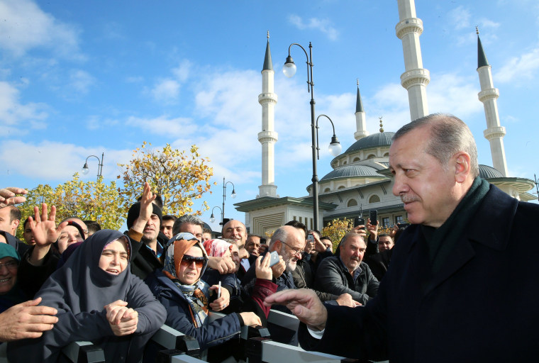 Image: Turkish President Erdogan greets his supporters after the Friday prayers in Ankara