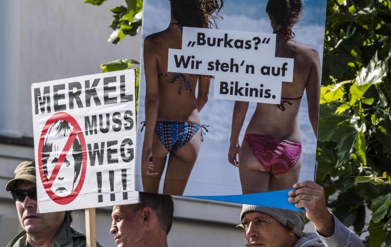 Image: AfD supporters carrying placards in 2017